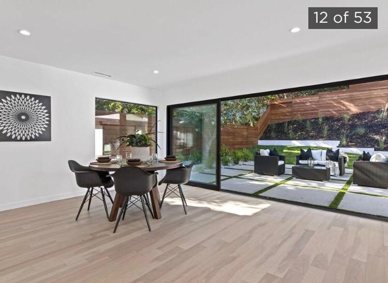 bright airy modern dining room with large sliding glass doors