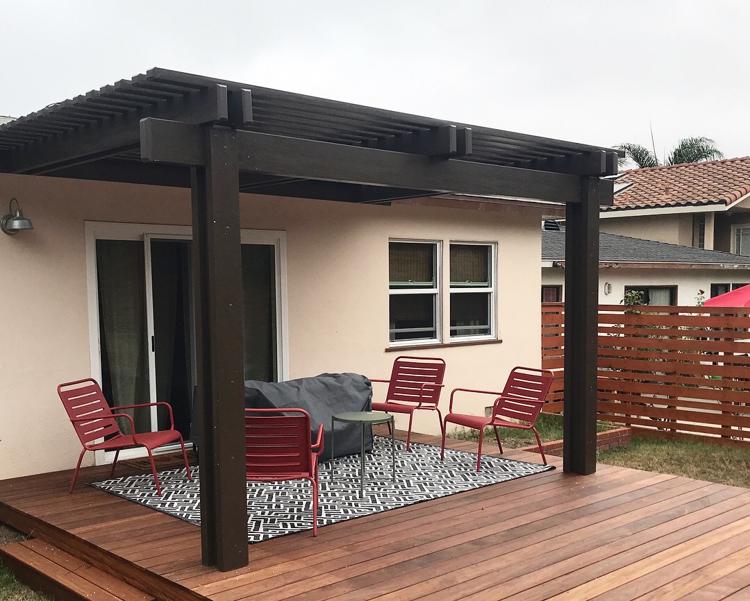 pergola on a backyard wooden deck