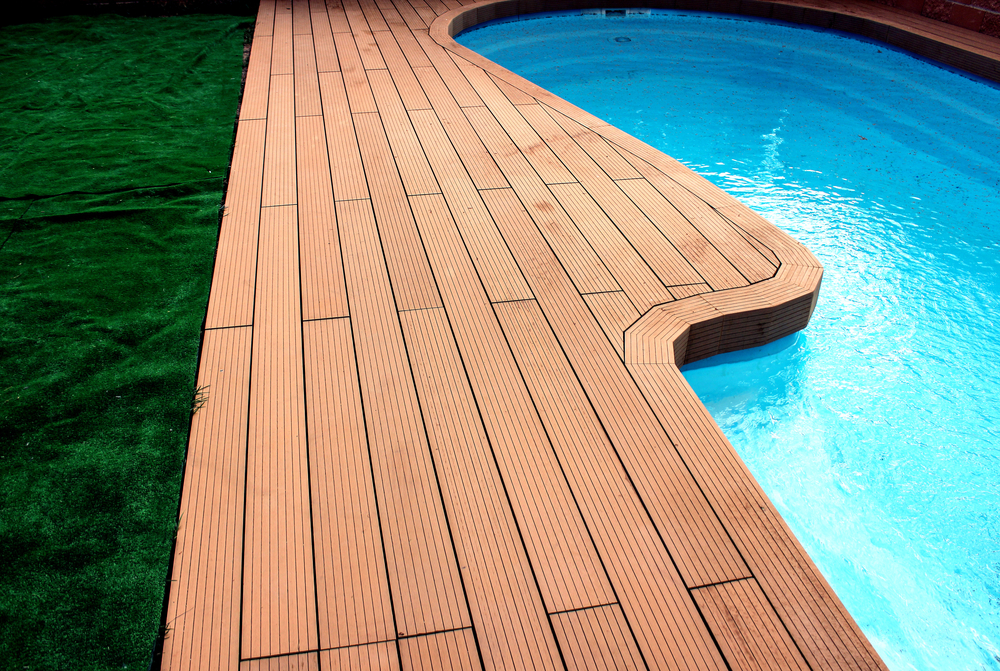 trex decking curving around a swimming pool