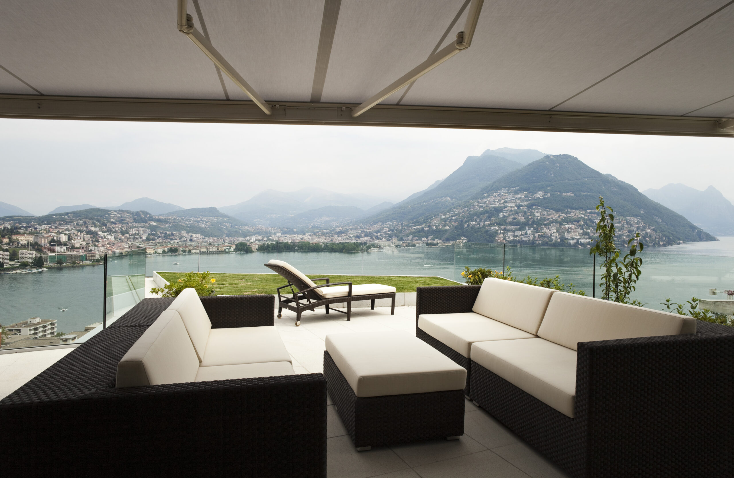 hillside city across the lake seen from beneath deck covering