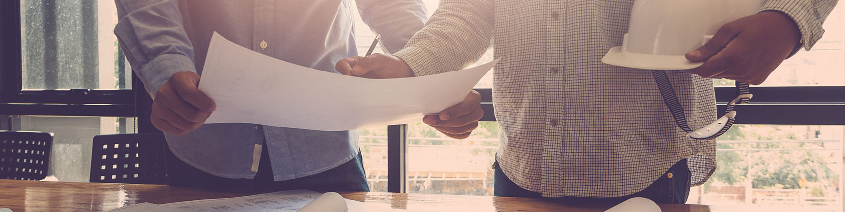 Construction workers going over plans.