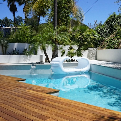 Elegant pool installed within a beautiful wood deck