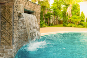 Small artificial waterfall in the swimming pool