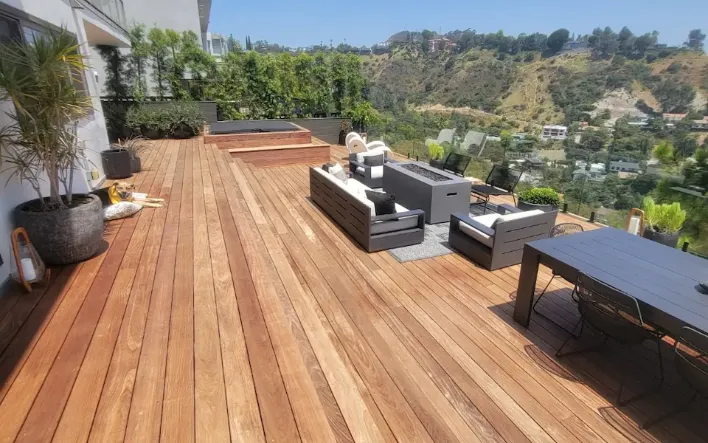 Airy and attractive wooden patio cover by MG Construction & Decks